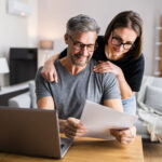 Couple Doing Taxes And Family Budget